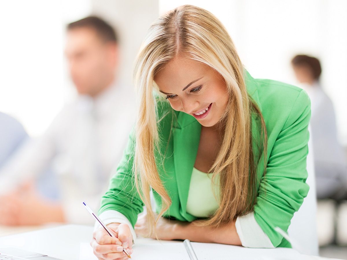Bookkeeper smiling wwhile working