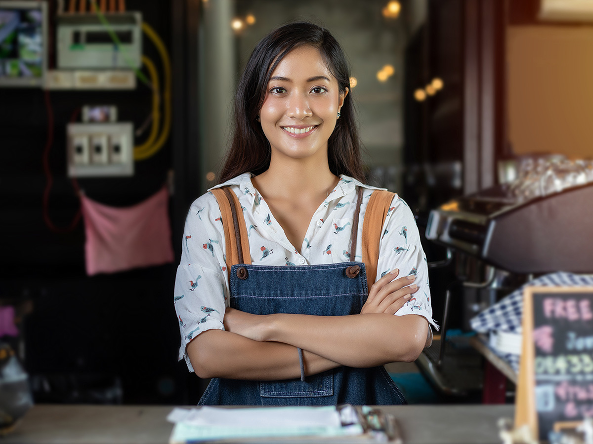 A young business owner smiling